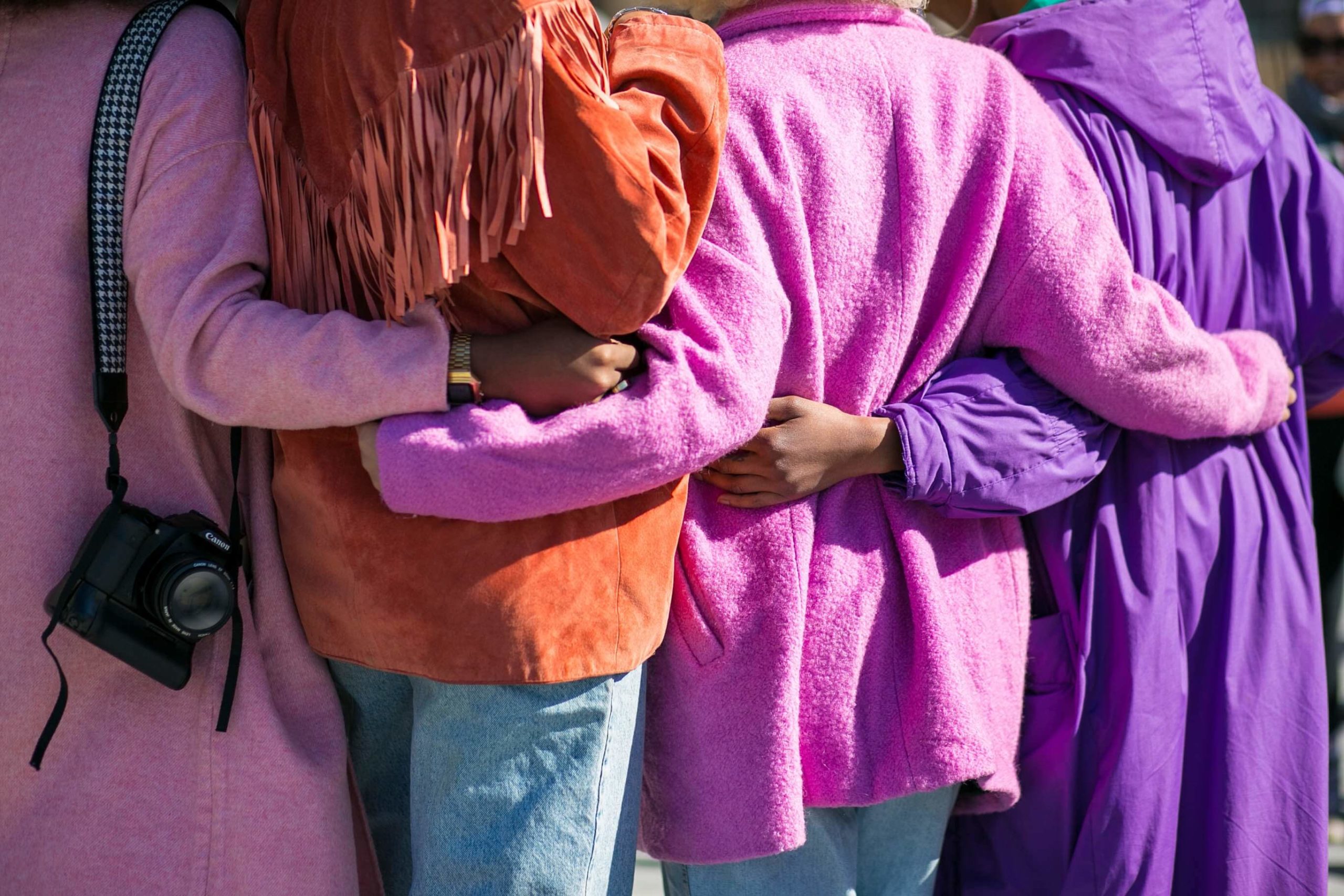 Women together embracing each other